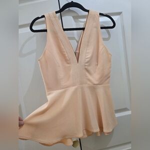 Elegant Peach Sleeveless Peplum Top